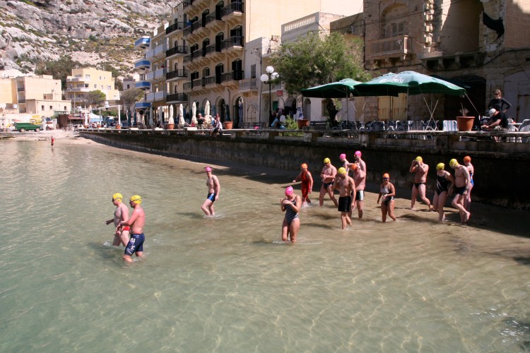 The group heads out for the six hour swim, looking less than excited or eager.